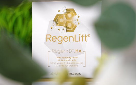 Close-up image of the Regen4D® Regenlift box, with green leaves in the foreground blurred by the camera's focus on the box.